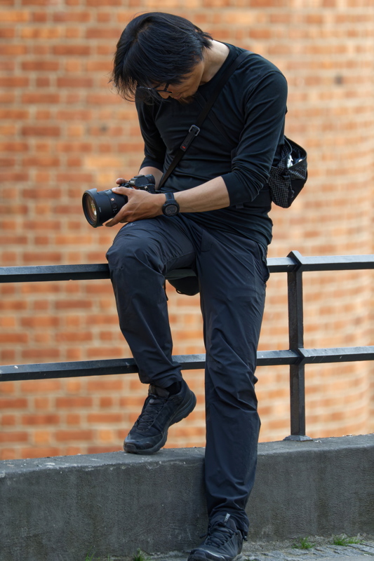 Young man preparing to take photos with his digital camera